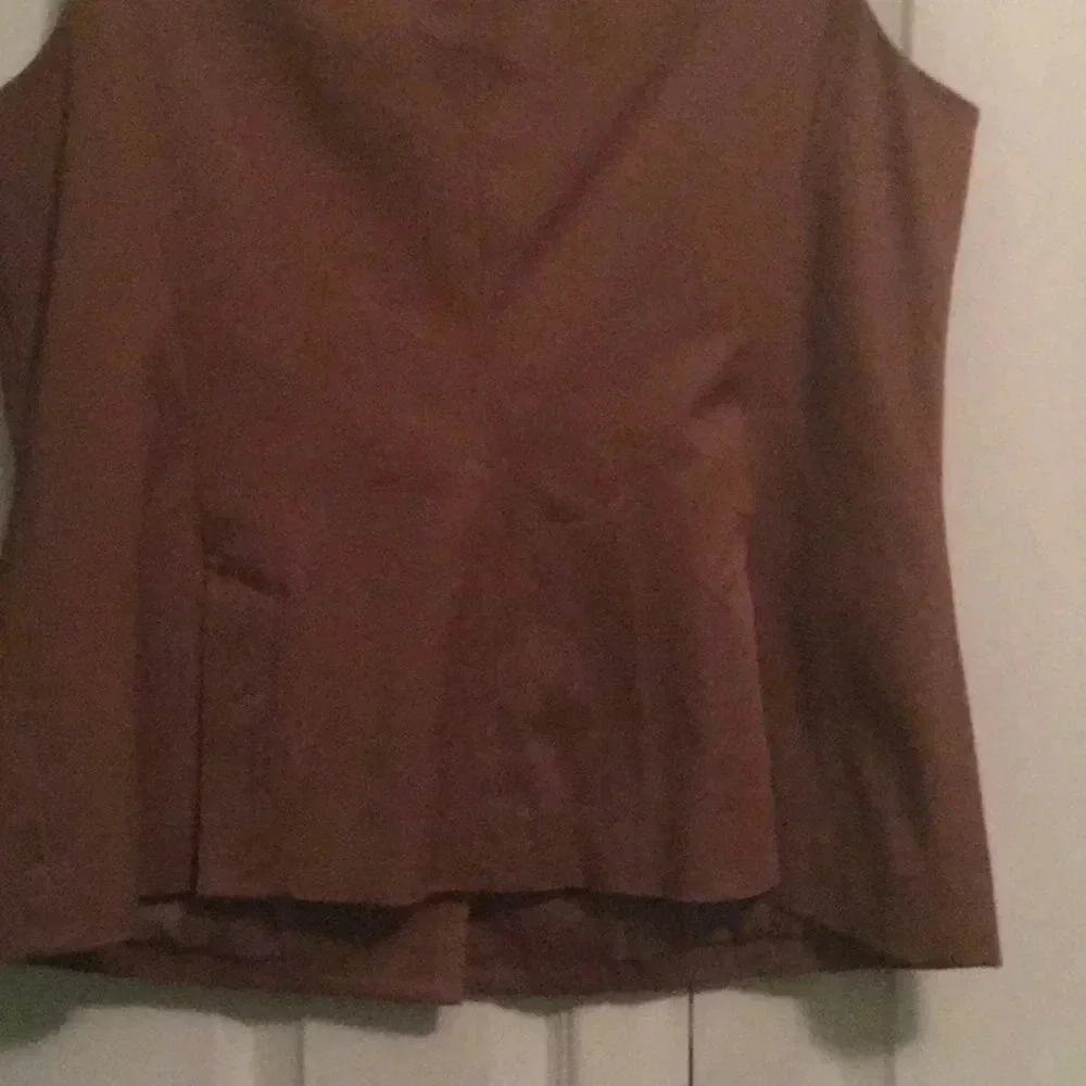 NYC sleeveless suit top and matching skirt